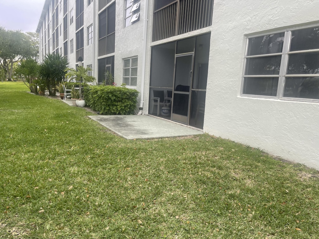 exterior space with a lawn