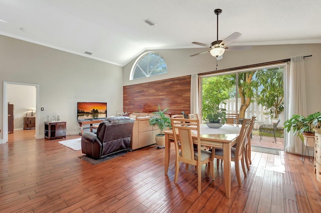 6090 Newport Village Way, Lake Worth, FL 33463 - dining space with crown molding, a ceiling fan, vaulted ceiling, and light wood finished floors