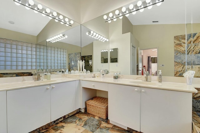 6090 Newport Village Way, Lake Worth, FL 33463 - bathroom with visible vents, vanity, and vaulted ceiling