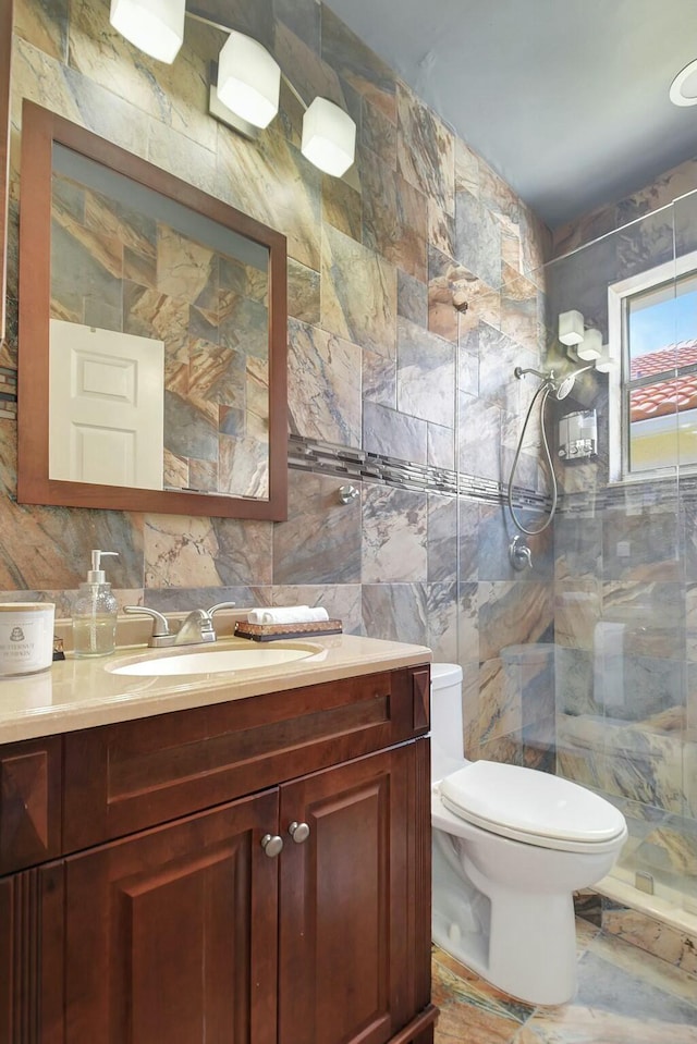6090 Newport Village Way, Lake Worth, FL 33463 - bathroom with toilet, tile walls, a shower stall, vanity, and backsplash