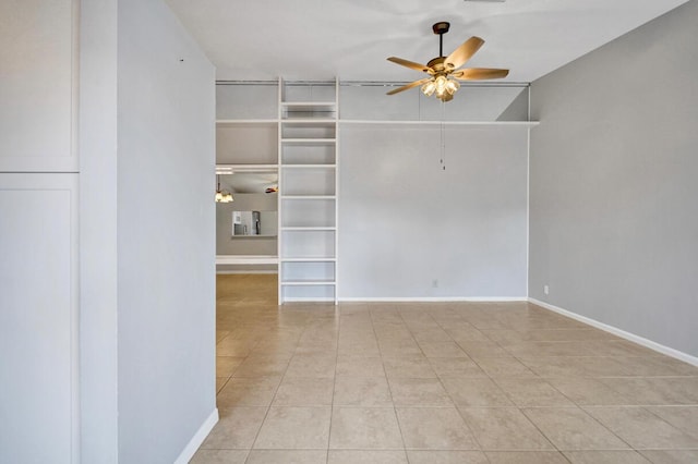 5680 Northpointe Ln, Boynton Beach, FL 33437 - tiled empty room with ceiling fan and baseboards