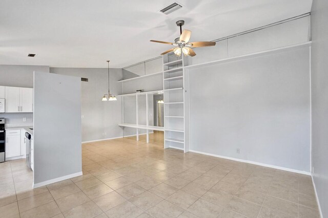 5680 Northpointe Ln, Boynton Beach, FL 33437 - unfurnished living room featuring visible vents, baseboards, ceiling fan with notable chandelier, and light tile patterned floors