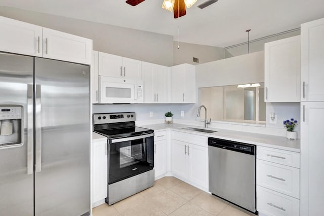 5680 Northpointe Ln, Boynton Beach, FL 33437 - kitchen with a sink, appliances with stainless steel finishes, ceiling fan, and light countertops