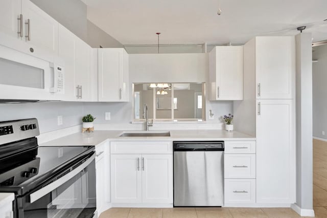 5680 Northpointe Ln, Boynton Beach, FL 33437 - kitchen with a sink, light countertops, stainless steel appliances, and a chandelier