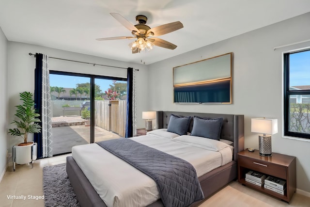5680 Northpointe Ln, Boynton Beach, FL 33437 - bedroom featuring baseboards, access to exterior, and ceiling fan