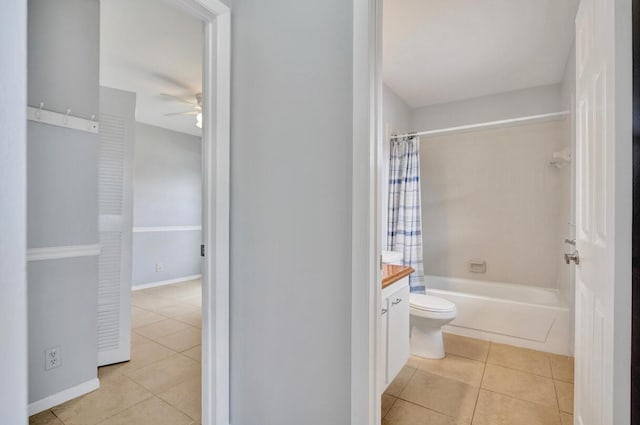 5680 Northpointe Ln, Boynton Beach, FL 33437 - bathroom featuring a ceiling fan, toilet, tile patterned flooring, and shower / bath combo with shower curtain