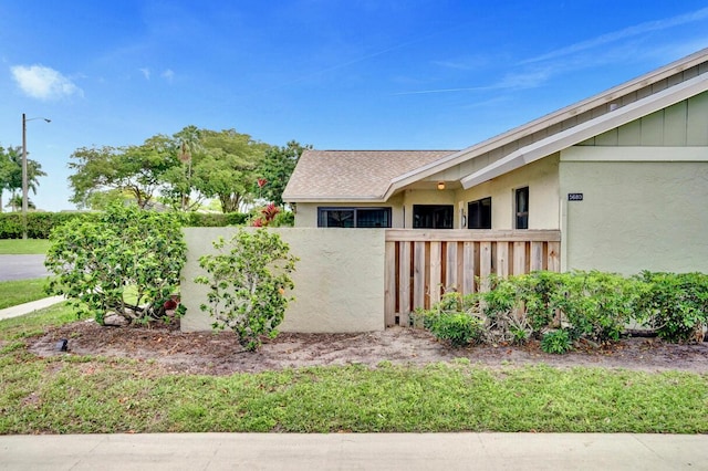 5680 Northpointe Ln, Boynton Beach, FL 33437 - view of side of property featuring fence and stucco siding