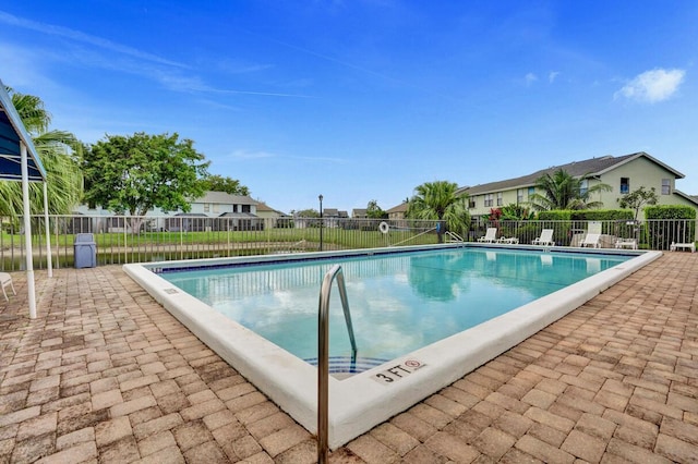 5680 Northpointe Ln, Boynton Beach, FL 33437 - pool featuring a patio, fence, and a residential view