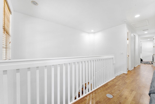 600 NW 24th Ave, Boynton Beach, FL 33426 - hallway featuring light wood-type flooring, an upstairs landing, recessed lighting, and baseboards