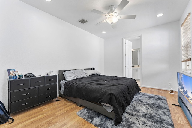 600 NW 24th Ave, Boynton Beach, FL 33426 - bedroom with light wood finished floors, baseboards, ceiling fan, recessed lighting, and connected bathroom