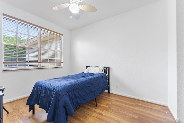 600 NW 24th Ave, Boynton Beach, FL 33426 - bedroom featuring wood finished floors, baseboards, and ceiling fan