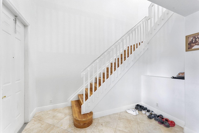600 NW 24th Ave, Boynton Beach, FL 33426 - stairway featuring baseboards and tile patterned flooring