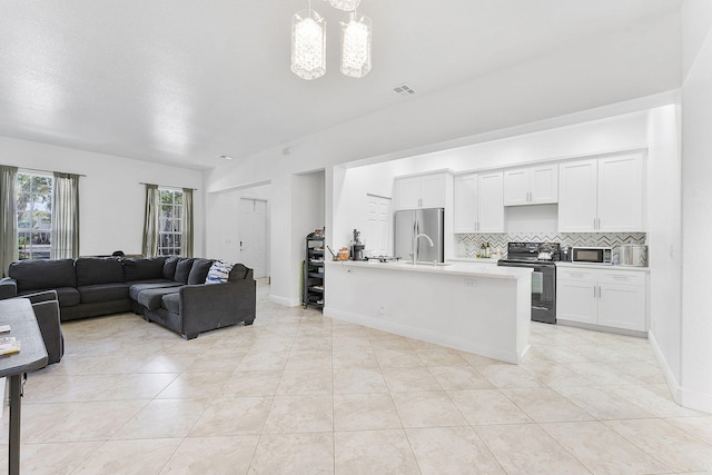 600 NW 24th Ave, Boynton Beach, FL 33426 - living area with light tile patterned flooring and a chandelier