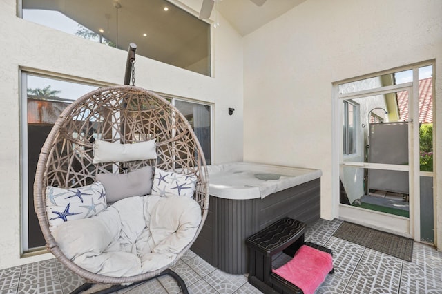 interior space with ceiling fan