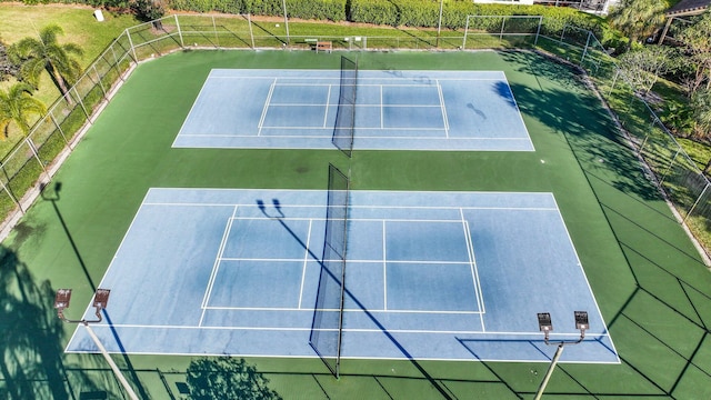 view of sport court with fence