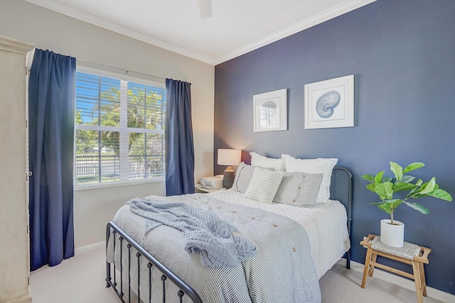 carpeted bedroom featuring baseboards, a ceiling fan, crown molding, and multiple windows