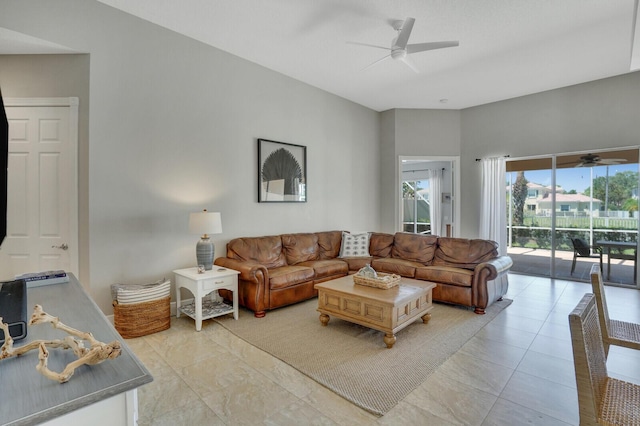 living area featuring a ceiling fan