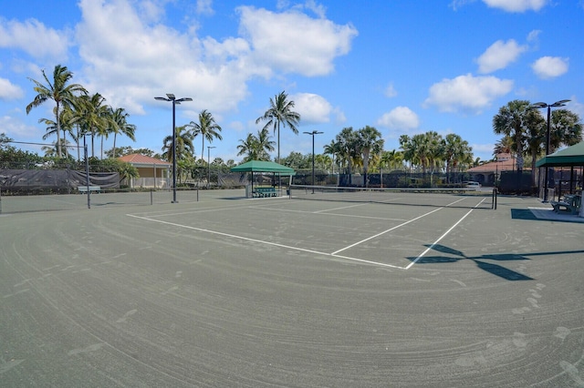 view of tennis court with fence