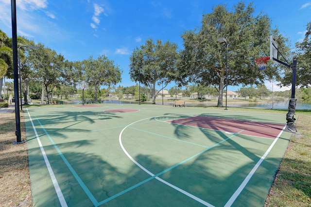 view of sport court with a water view and community basketball court