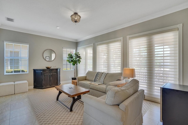 living room featuring light tile patterned floors, baseboards, ornamental molding, and visible vents