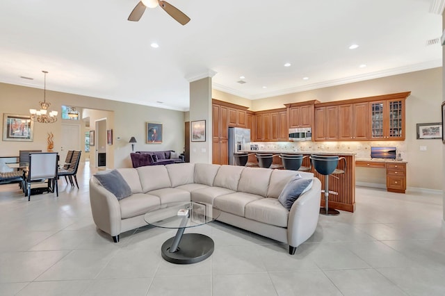 6722 Watertown Dr, Boynton Beach, FL 33437 - living area featuring light tile patterned floors, visible vents, ornamental molding, recessed lighting, and ceiling fan with notable chandelier