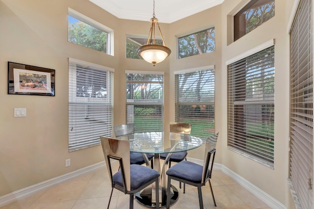 6722 Watertown Dr, Boynton Beach, FL 33437 - dining area with crown molding, light tile patterned floors, baseboards, and a towering ceiling