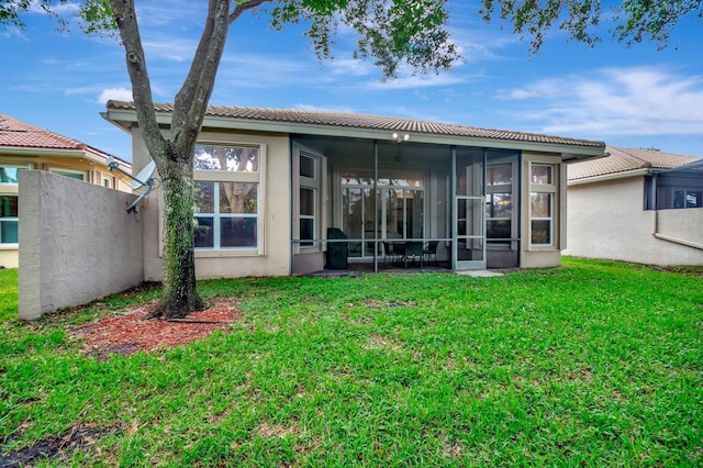 6722 Watertown Dr, Boynton Beach, FL 33437 - rear view of property with a tiled roof, a sunroom, a lawn, and stucco siding