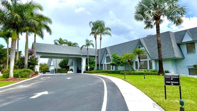 exterior space featuring curved driveway