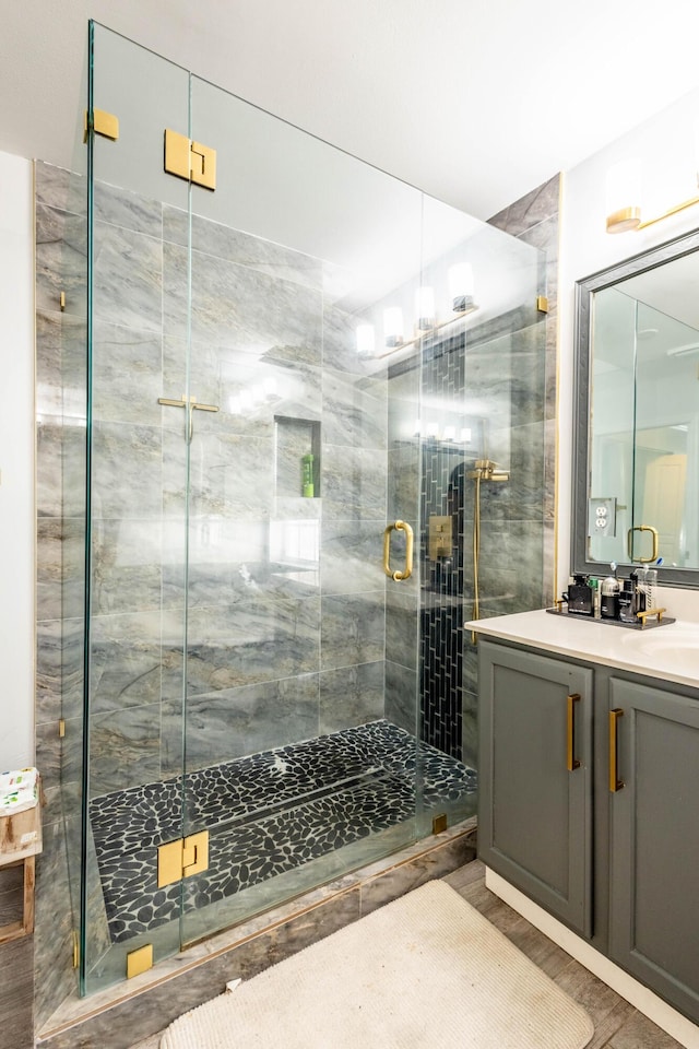 full bathroom featuring vanity and a stall shower