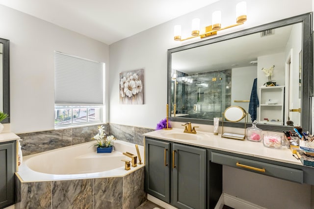 full bathroom featuring vanity, a stall shower, and a garden tub