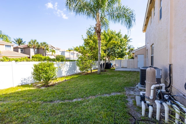 view of yard with a fenced backyard and a residential view