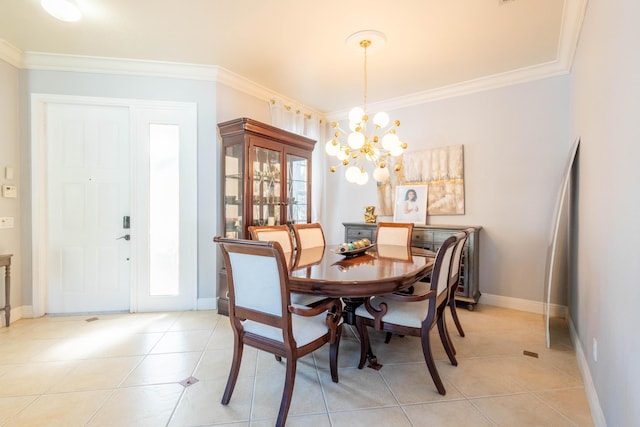 dining space with a notable chandelier, ornamental molding, and light tile patterned flooring