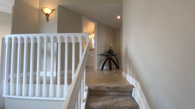 staircase with baseboards and recessed lighting