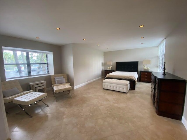 bedroom with recessed lighting, baseboards, and multiple windows