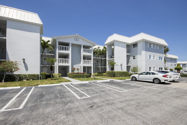 11 Colonial Club Dr Unit 302, Boynton Beach, FL 33435 - drone / aerial view of a pool and a large body of water