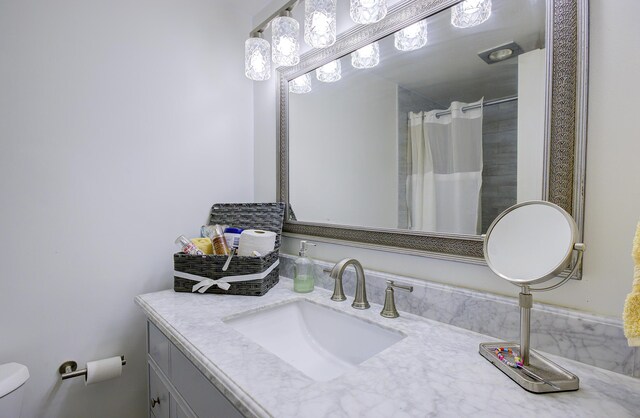 11 Colonial Club Dr Unit 302, Boynton Beach, FL 33435 - bathroom with vanity, toilet, and a shower with shower curtain