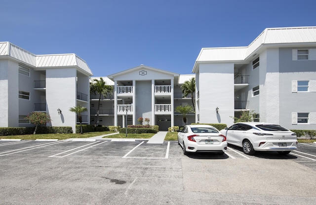 11 Colonial Club Dr Unit 302, Boynton Beach, FL 33435 - view of uncovered parking lot