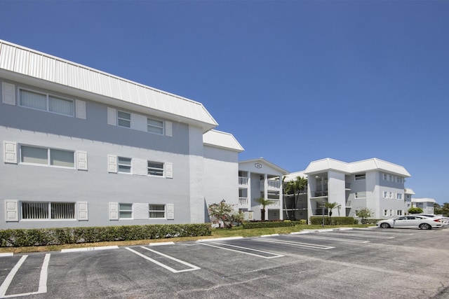 11 Colonial Club Dr Unit 302, Boynton Beach, FL 33435 - view of property with uncovered parking