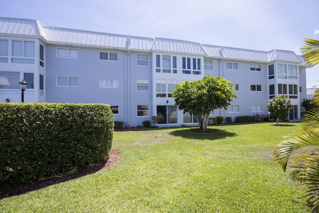 11 Colonial Club Dr Unit 302, Boynton Beach, FL 33435 - view of property with uncovered parking