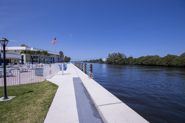 11 Colonial Club Dr Unit 302, Boynton Beach, FL 33435 - dock featuring a water view