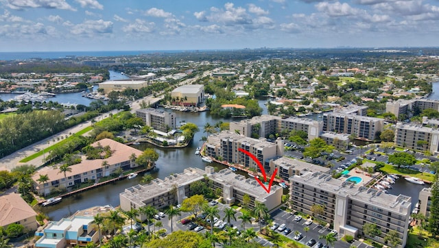 aerial view featuring a water view and a view of city