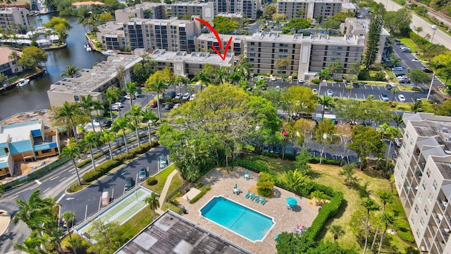 birds eye view of property featuring a water view and a view of city