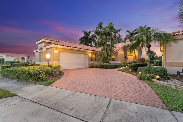 8004 Copenhagen Way, Boca Raton, FL 33434 - mediterranean / spanish home with a tile roof, stucco siding, and decorative driveway