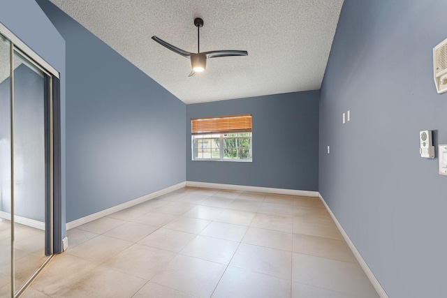 8004 Copenhagen Way, Boca Raton, FL 33434 - unfurnished bedroom with a textured ceiling, lofted ceiling, tile patterned flooring, a ceiling fan, and a closet