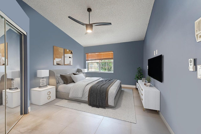 8004 Copenhagen Way, Boca Raton, FL 33434 - bedroom with a textured ceiling, vaulted ceiling, a closet, light tile patterned floors, and ceiling fan