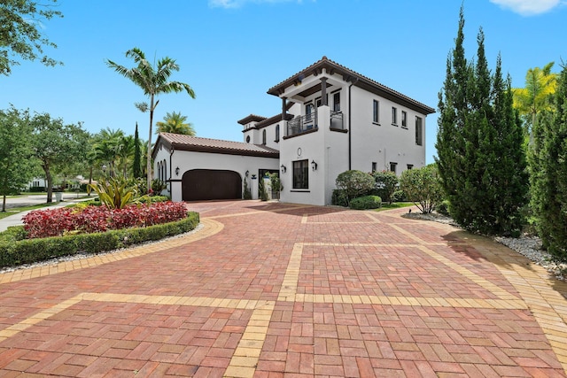 9650 Eden Mnr, Parkland, FL 33076 - mediterranean / spanish house with a garage, stucco siding, a tiled roof, and decorative driveway