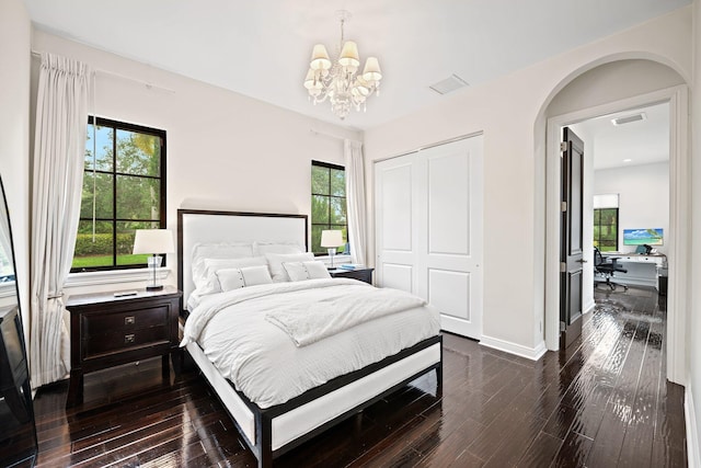 9650 Eden Mnr, Parkland, FL 33076 - bedroom with visible vents, dark wood finished floors, baseboards, a closet, and an inviting chandelier