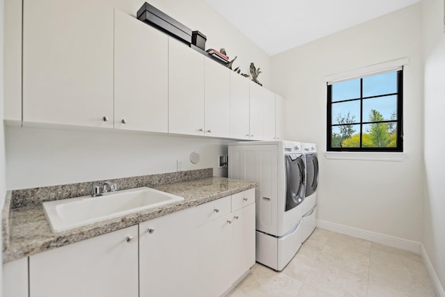 9650 Eden Mnr, Parkland, FL 33076 - clothes washing area with cabinet space, baseboards, washer and clothes dryer, and a sink