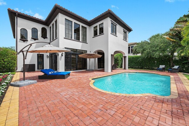9650 Eden Mnr, Parkland, FL 33076 - view of swimming pool featuring a fenced in pool and a patio area