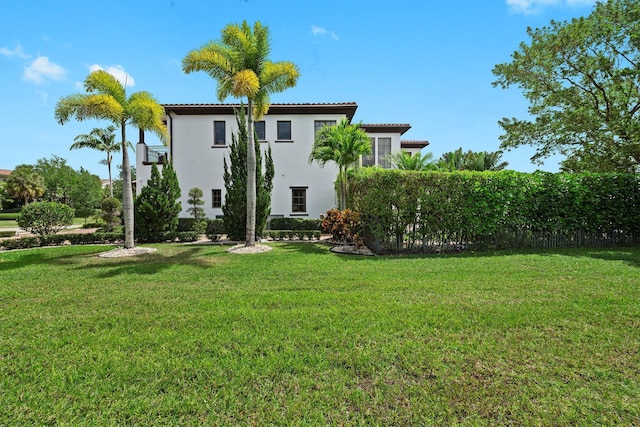 9650 Eden Mnr, Parkland, FL 33076 - back of property featuring a yard, a tiled roof, and stucco siding